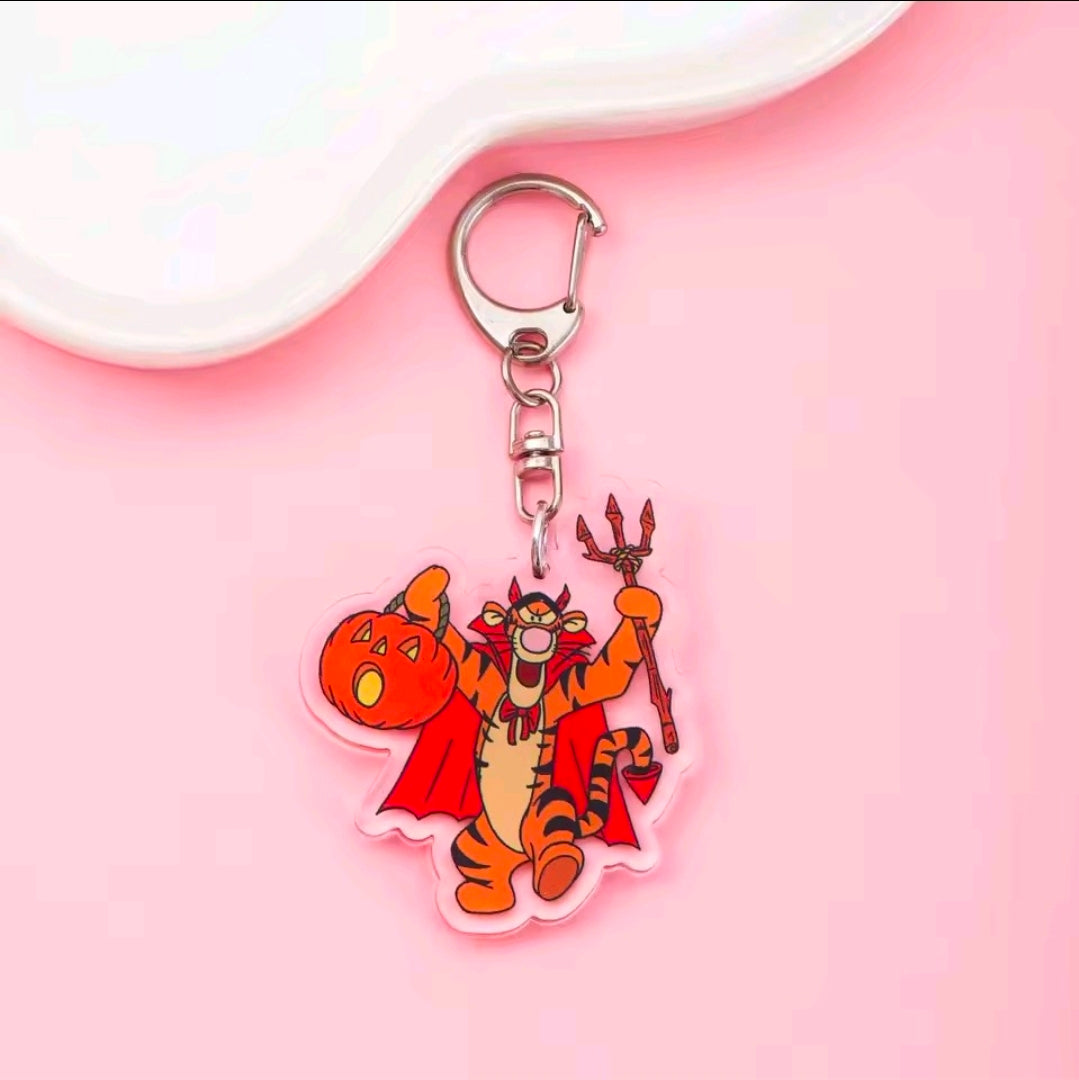 Acrylic Halloween keychain with carabiner; orange-and-red devil costume character charm with horns.