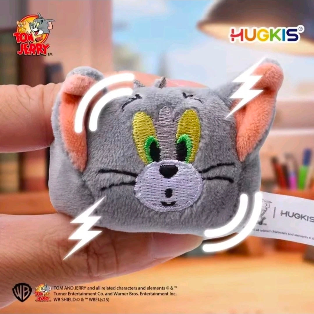 Gray mini plush keychain with green and yellow eyes, stitched cartoon face on silver chain