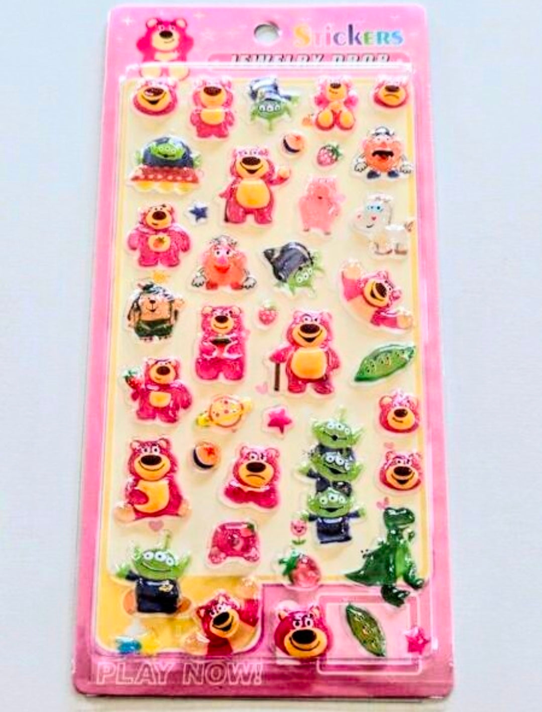 3D acrylic sticker sheet in pink card, featuring many colorful cartoon characters and aliens