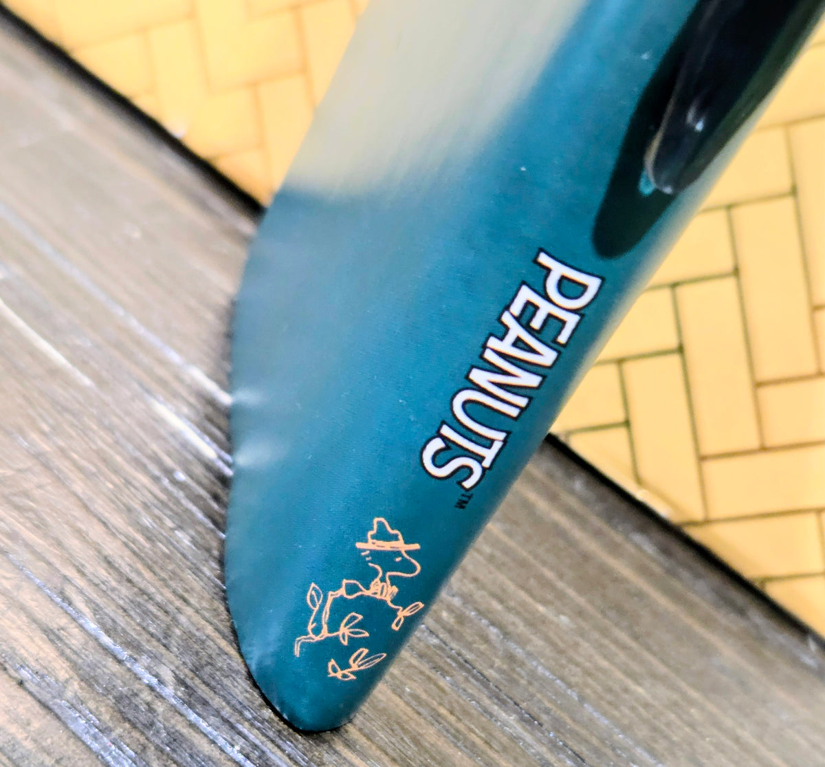 Blue pen with white 'PENGUINS' lettering and small character graphic near the tip