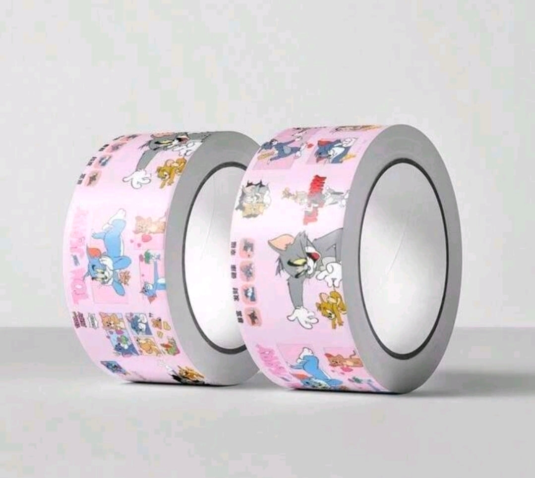 Pair of pink-and-gray Tom & Jerry washi tape rolls, cartoon characters allover
