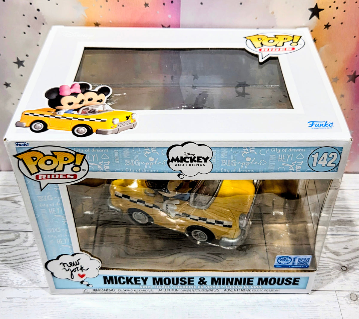 Funko Pop Rides #142 box featuring Mickey Mouse and Minnie Mouse yellow taxi