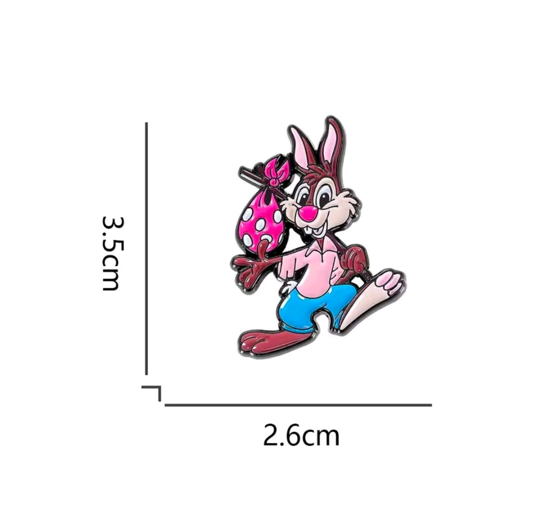 Enamel lapel pin of Br’er Rabbit in pink polka-dot bow and teal shorts