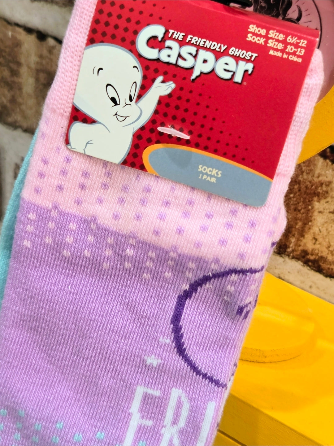 Lavender crew socks with Casper outline and partial text on leg