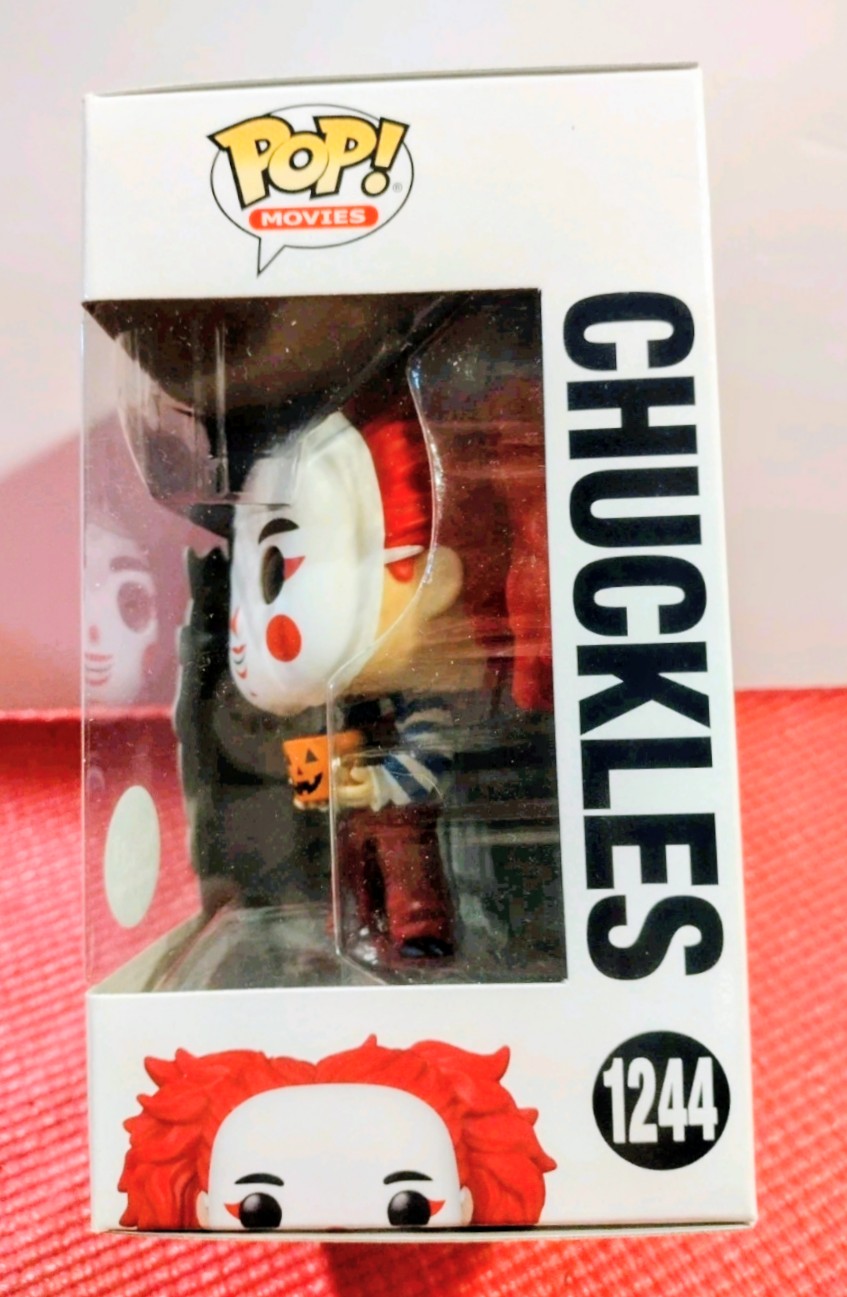 Chuckles Funko Pop! figure in box with side window, red hair and jack-o-lantern