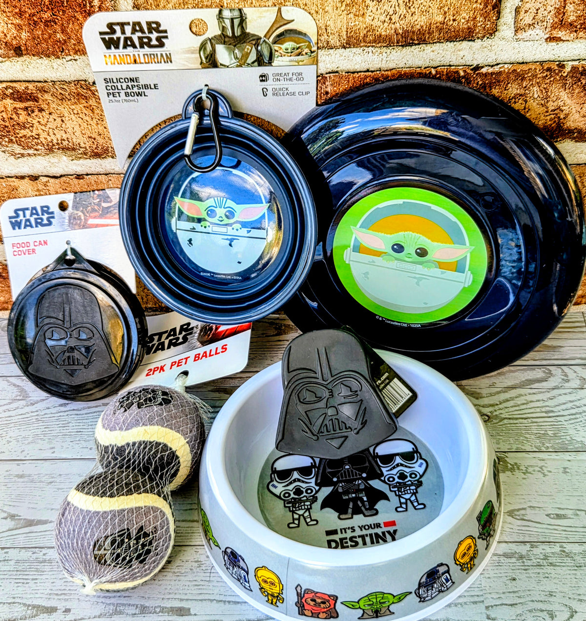 Pet bowls and Frisbees with Grogu and Vader graphics, plus small mesh treat bag