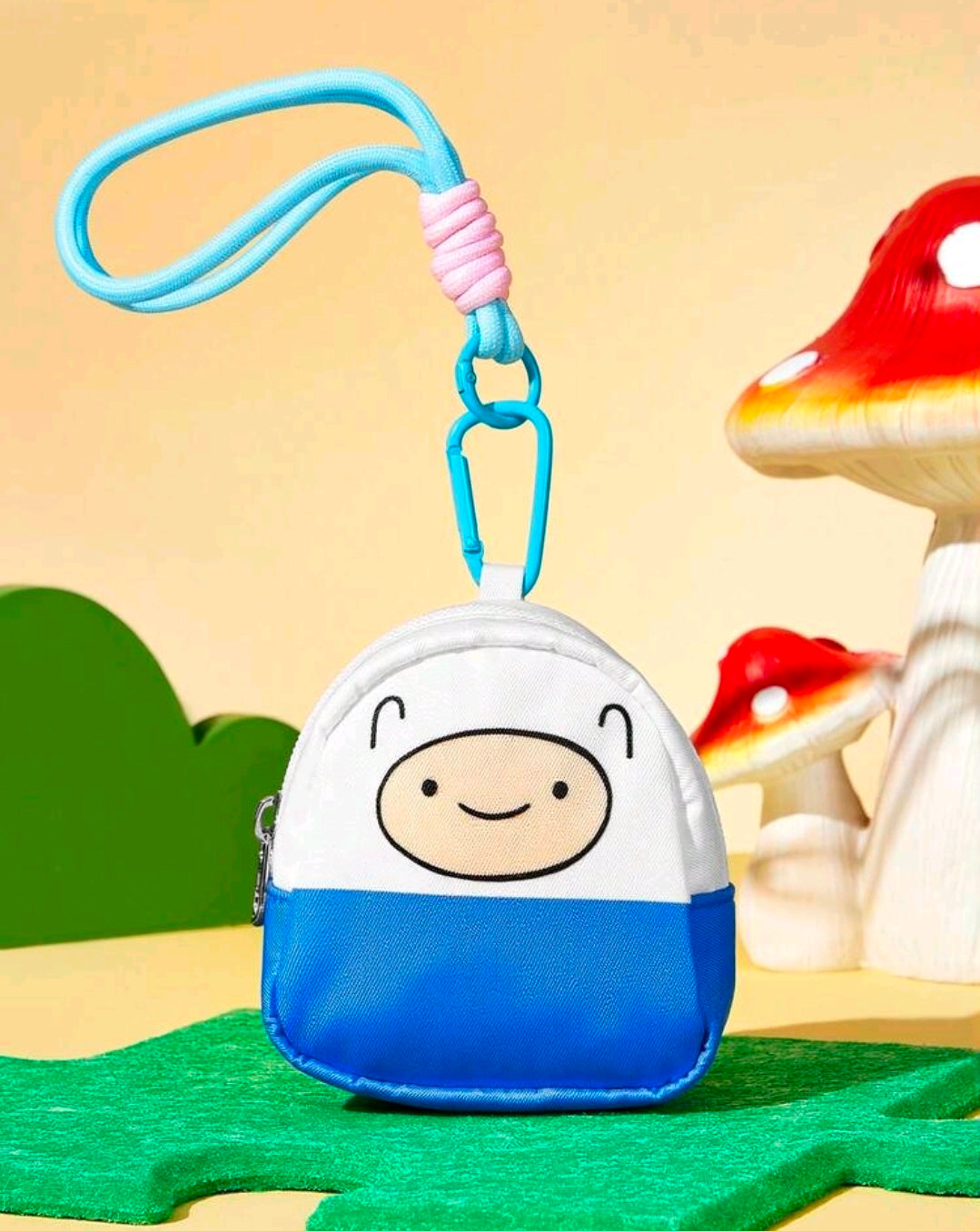 Mini zip coin purse on blue lanyard, white-and-blue character face front