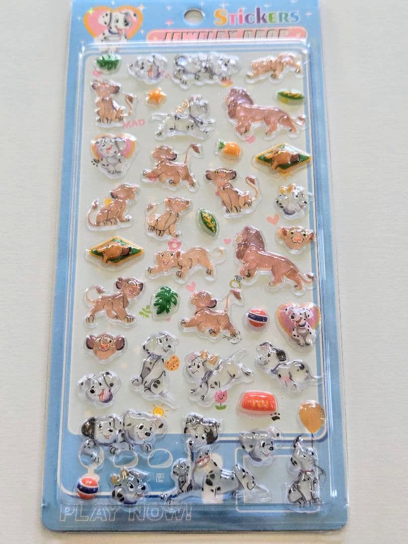 Disney 101 Dalmatians & Lion King themed sticker sheet with glossy animal icons