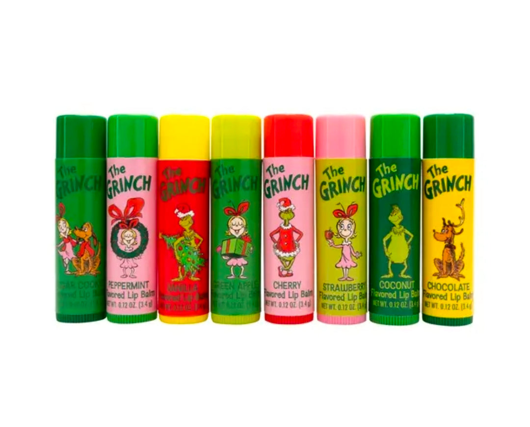Row of eight The Grinch flavored lip balm tubes in green, yellow, red, and pink
