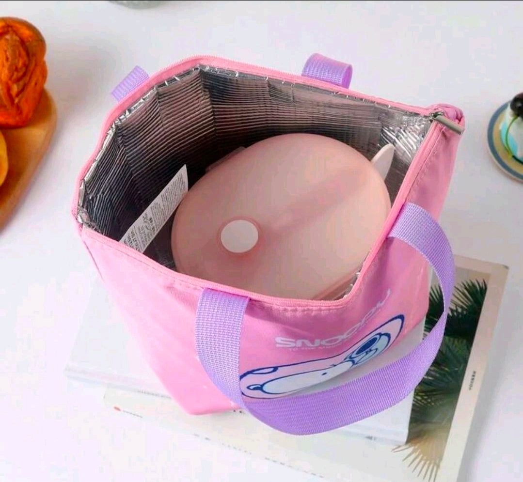 Open pink insulated lunch bag with purple handles, showing silver lining and Snoopy patch