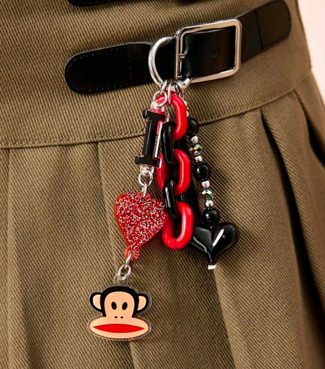 Red and black chain keychain with glitter heart and monkey face charm