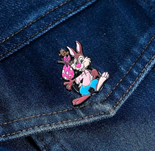 Br’er Rabbit enamel pin on blue denim fabric