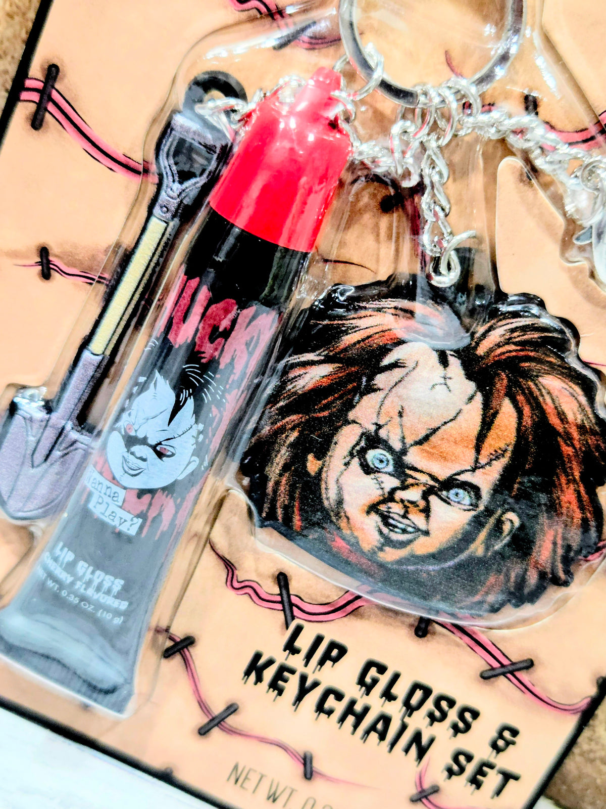 Chucky lip gloss and keychain set with two clear bottles and character keychain
