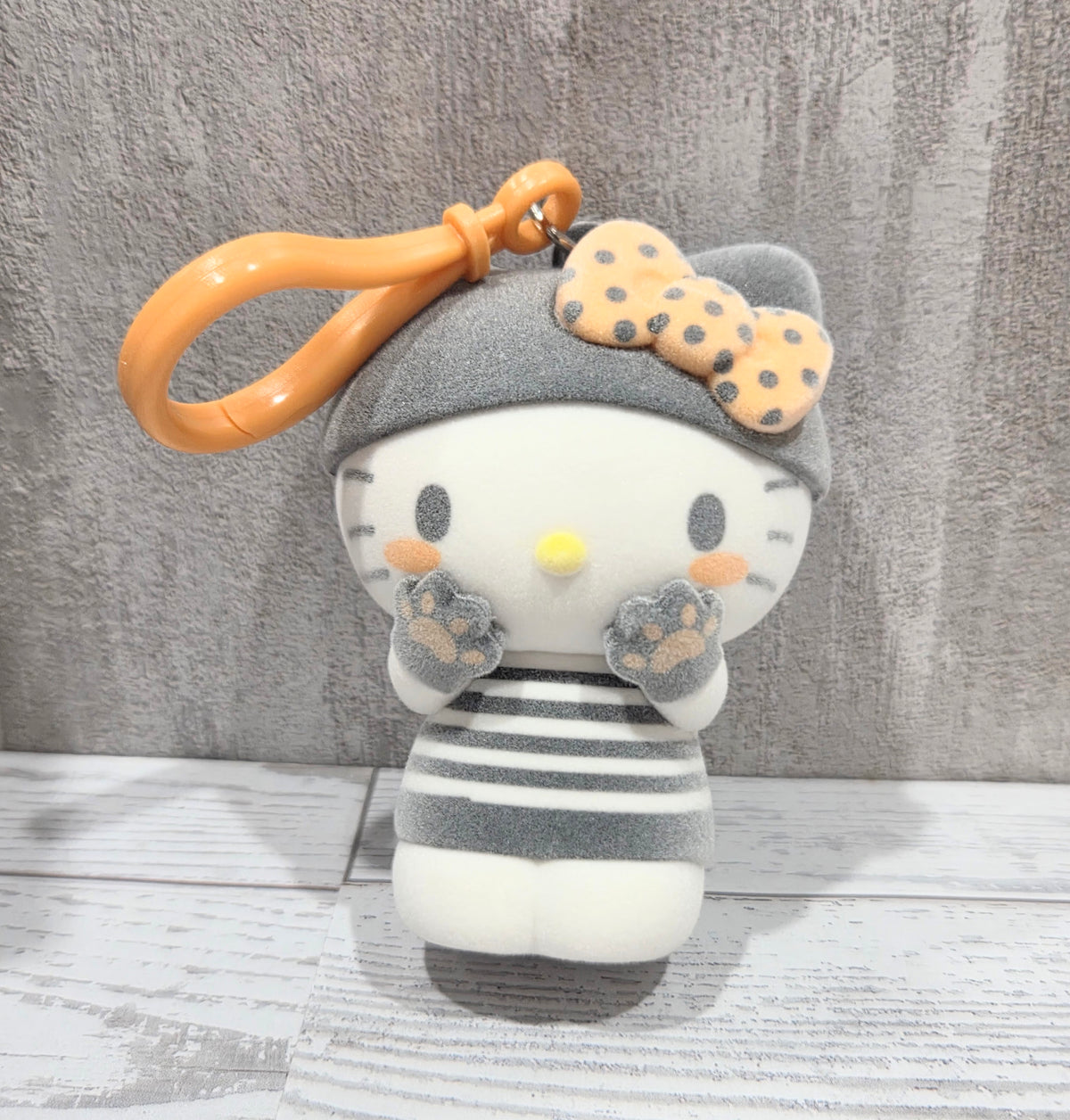 Front view flocked grey cat bag clip/hanger with orange loop and cookie charm