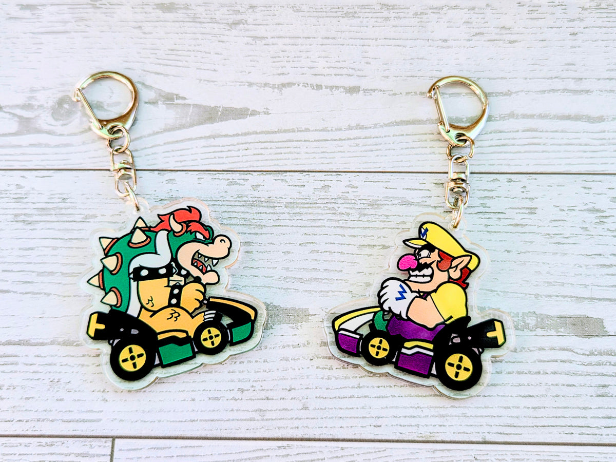 2-piece acrylic keychain set with Bowser and Wario racing kart charms