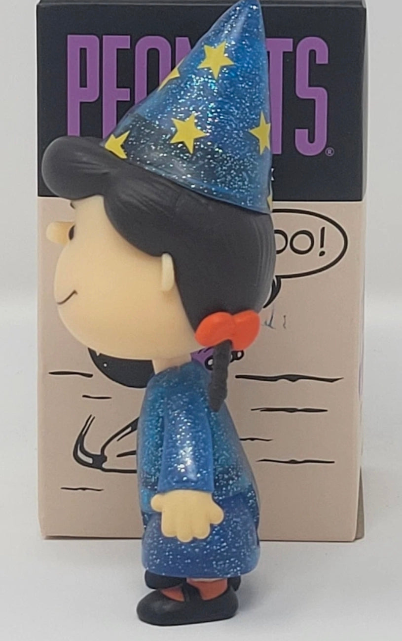 Side view glitter blue Halloween vinyl figure with star wizard hat and purple-blue outfit