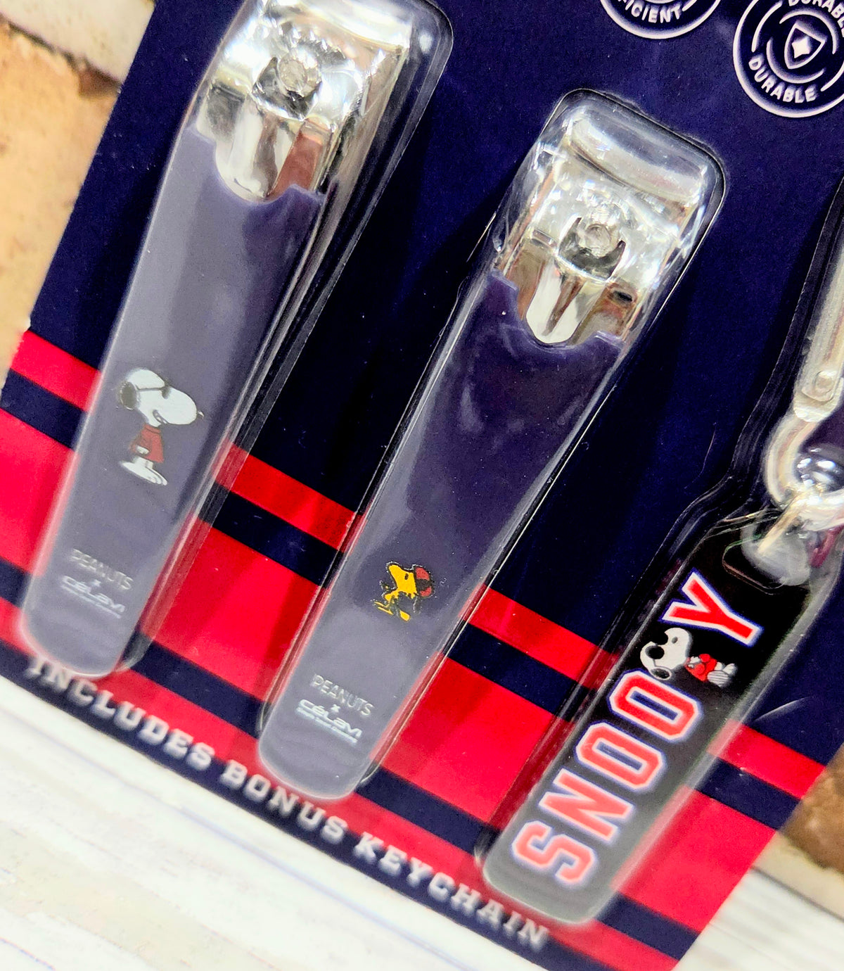 Close-up of two nail clippers and bonus keychain on retail card