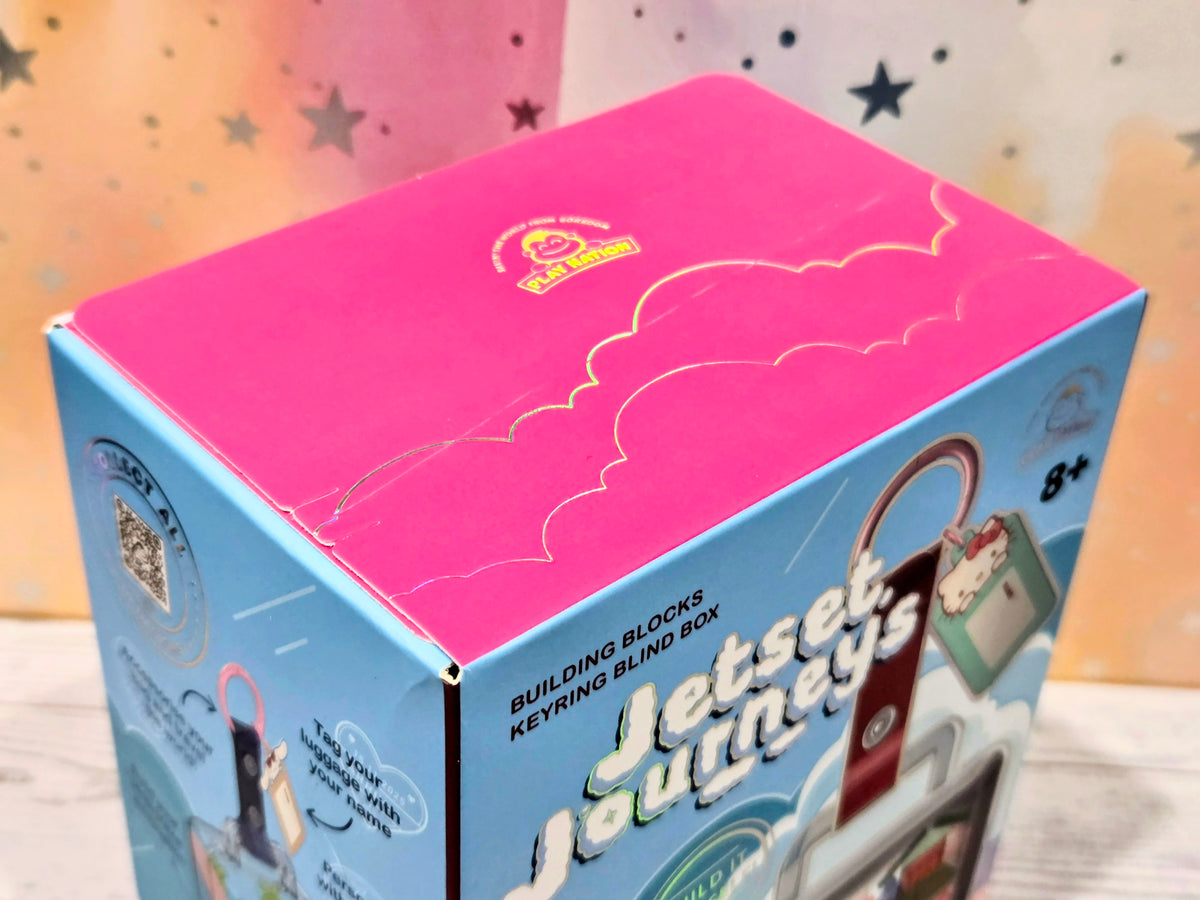 Hello Kitty Jetset Journeys building block keychain box top with pink lid