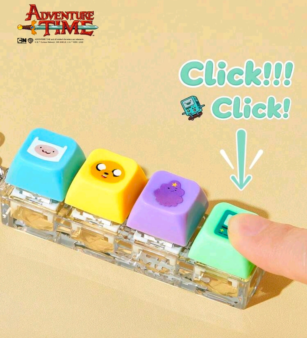 Keyboard clicker fidget keychain set with four cube buttons, finger pressing the green one