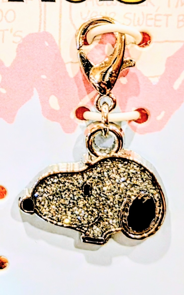 Gold-tone glitter dog tag charm with a pink heart-accent loop dangle