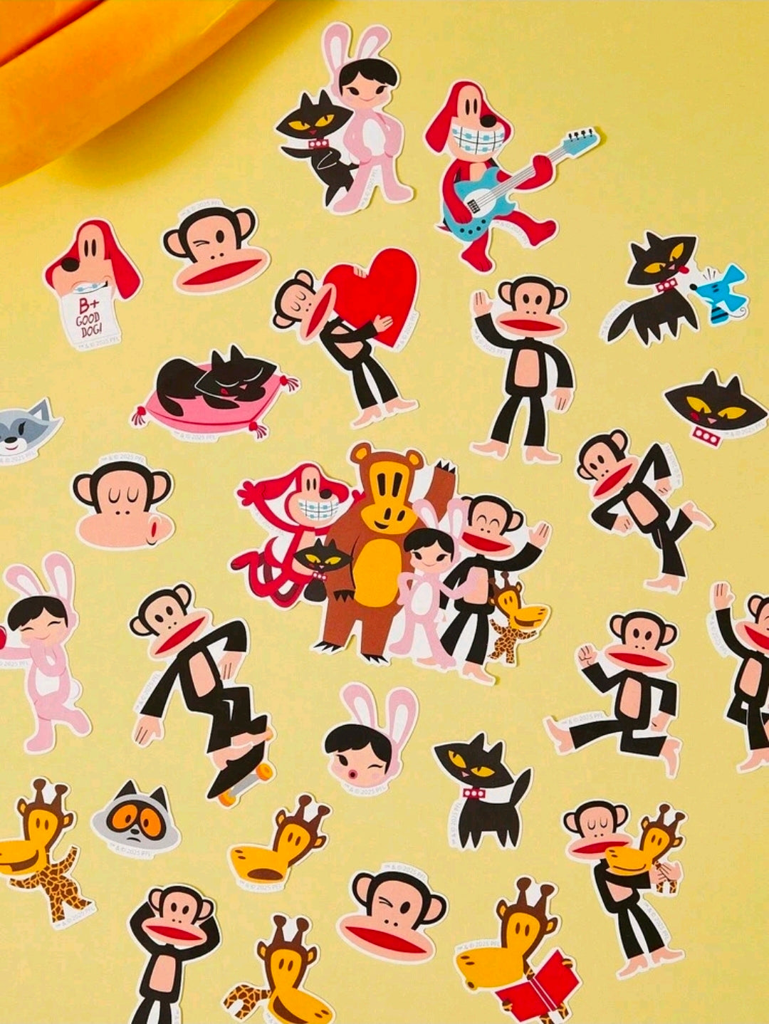 Sheet of vinyl cartoon character stickers with many monkeys and cats in bright colors