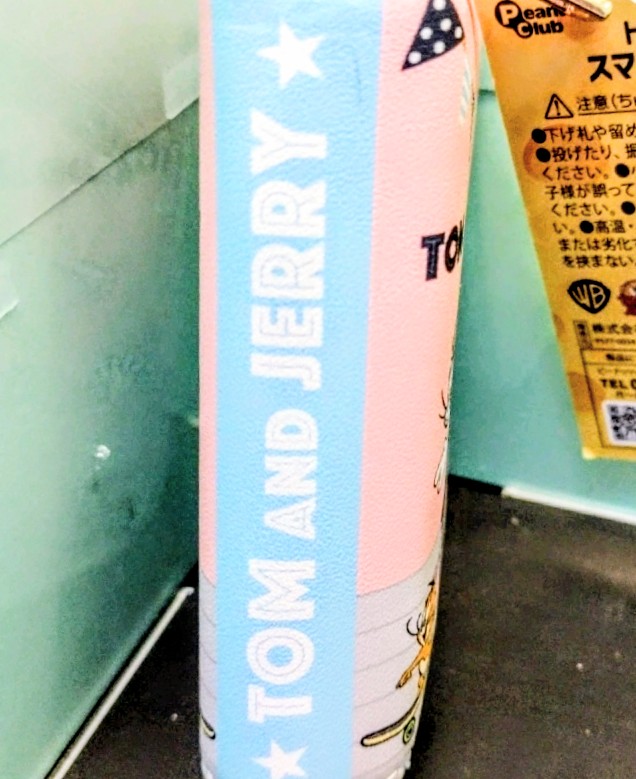 Pink and light blue vertical Tom and Jerry smart key case with “TOM & JERRY” text