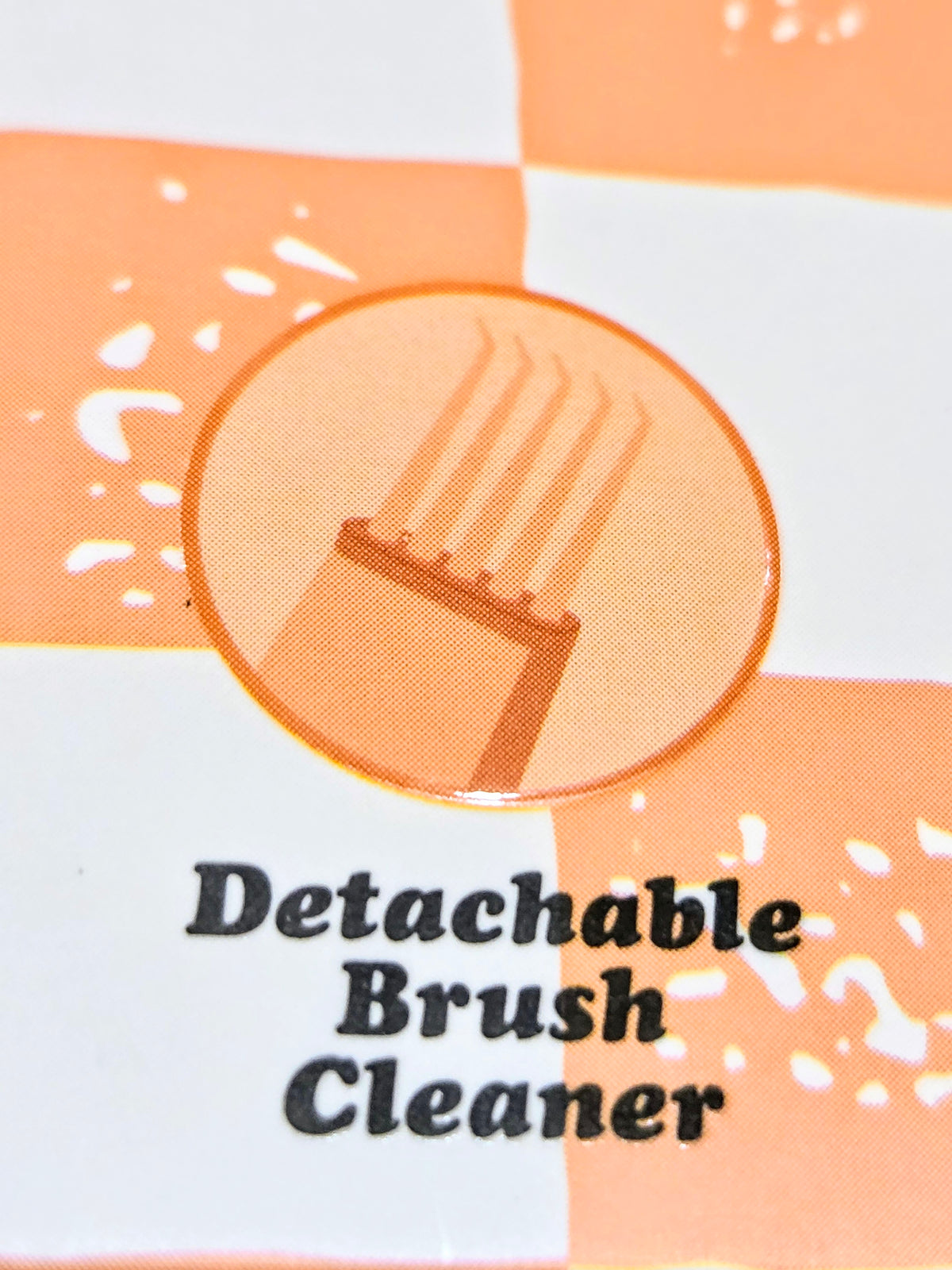 Detachable brush cleaner text and illustrated cleaner graphic on packaging