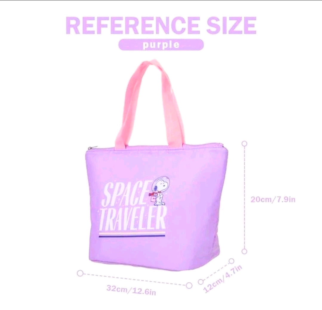 Purple insulated lunch bag tote with pink handles and “Space Traveler” Snoopy design