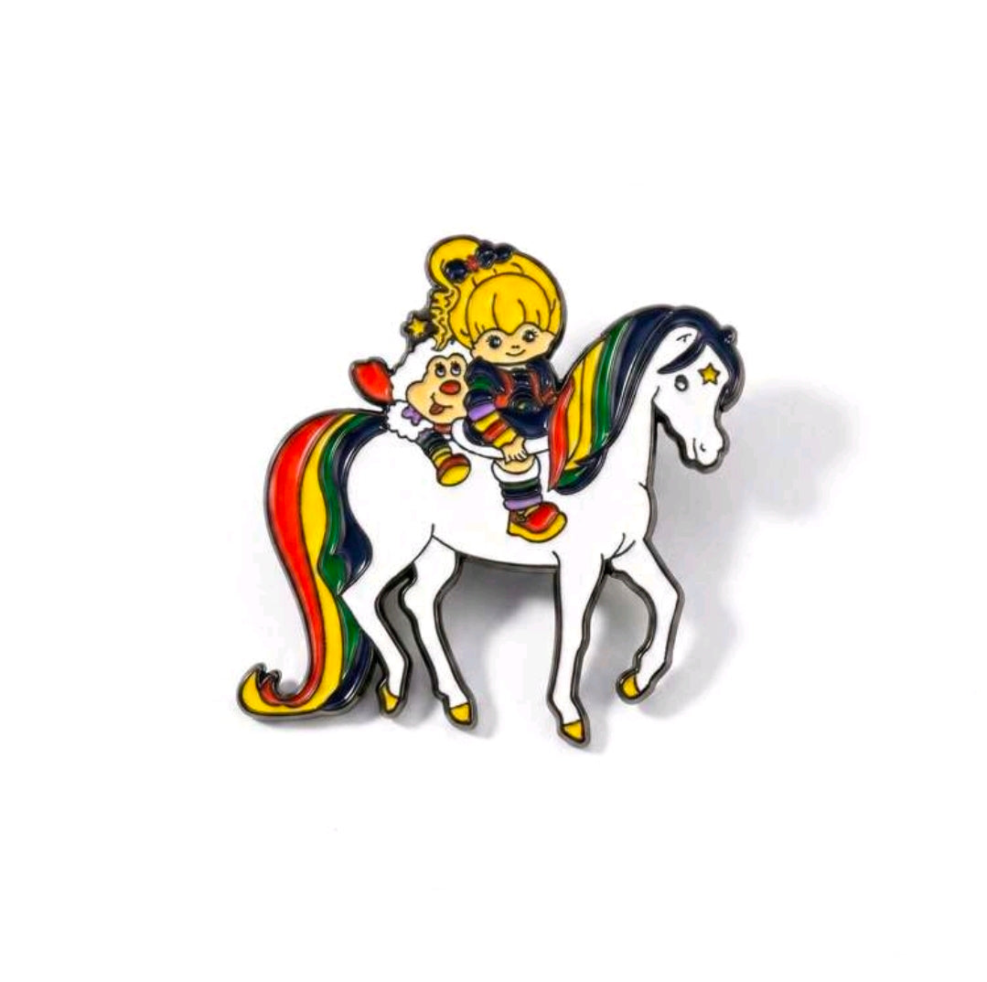 Enamel riding duo pin of a blond girl on a white horse with rainbow mane