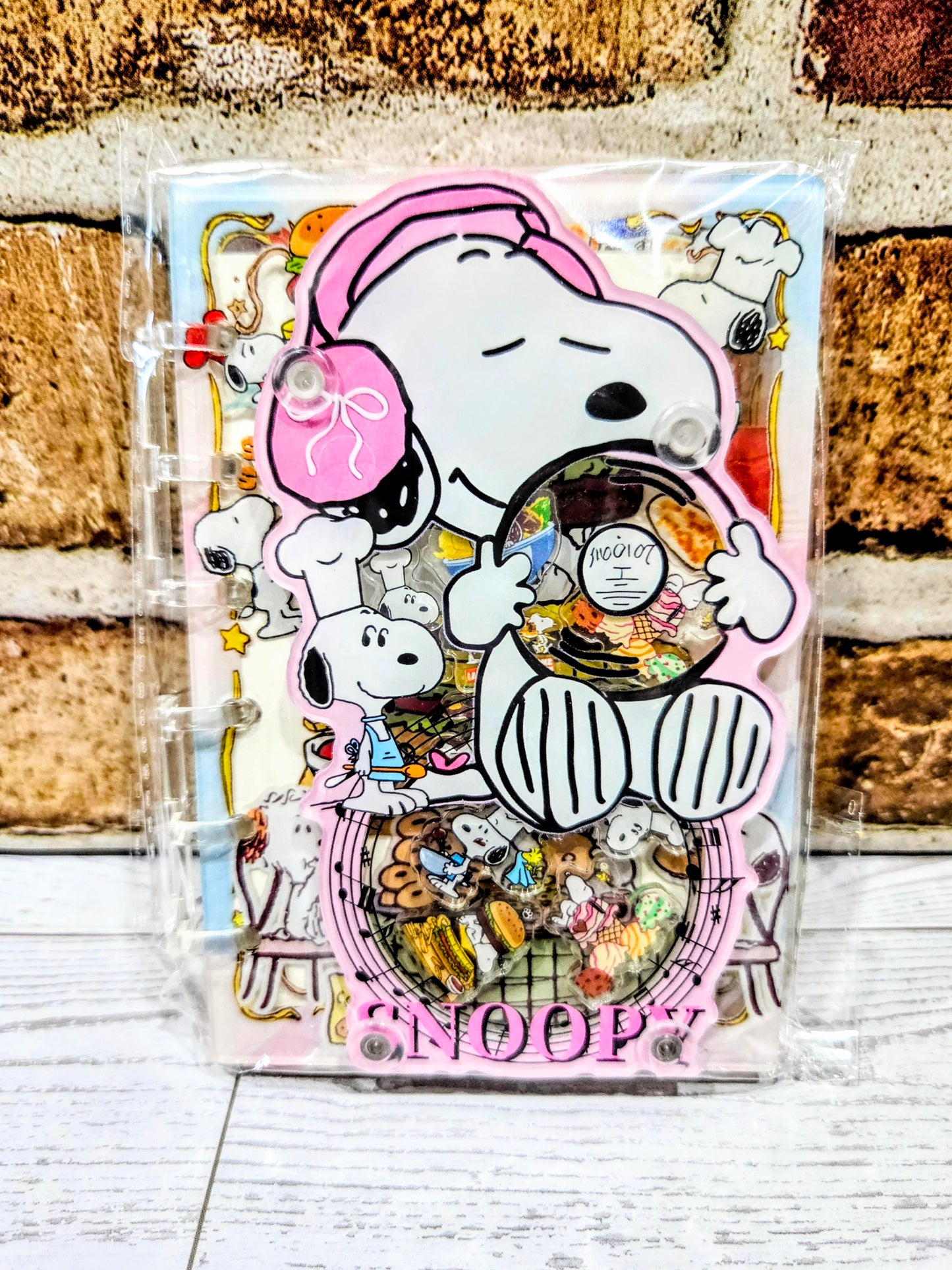 Pink acrylic shaker notebook cover with Snoopy chef, mice, and colorful food confetti
