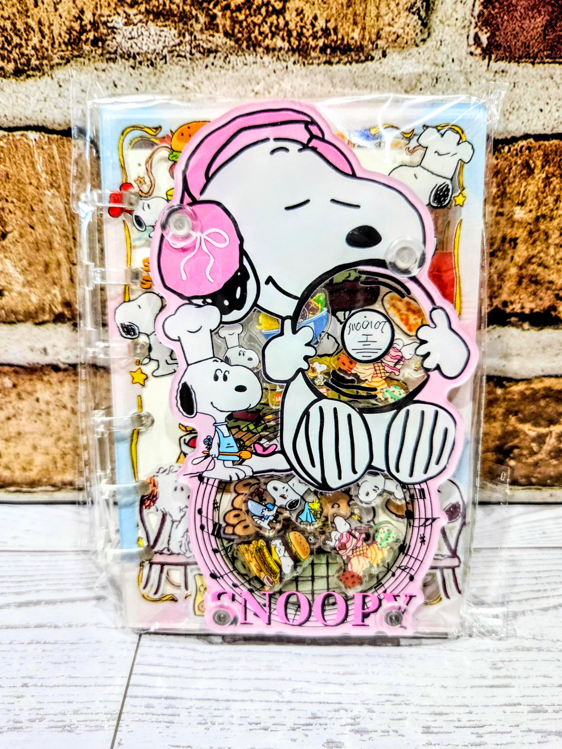 Pink acrylic shaker notebook cover with Snoopy chef, mice, and colorful food confetti