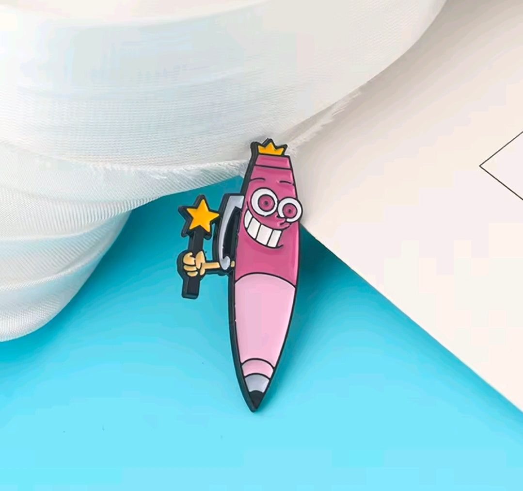 Close-up of a pink enamel character pin holding a dark wand with a star