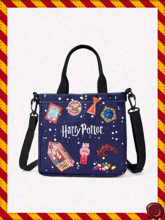 Navy canvas tote bag with black crossbody straps, printed charms, and white polka dots