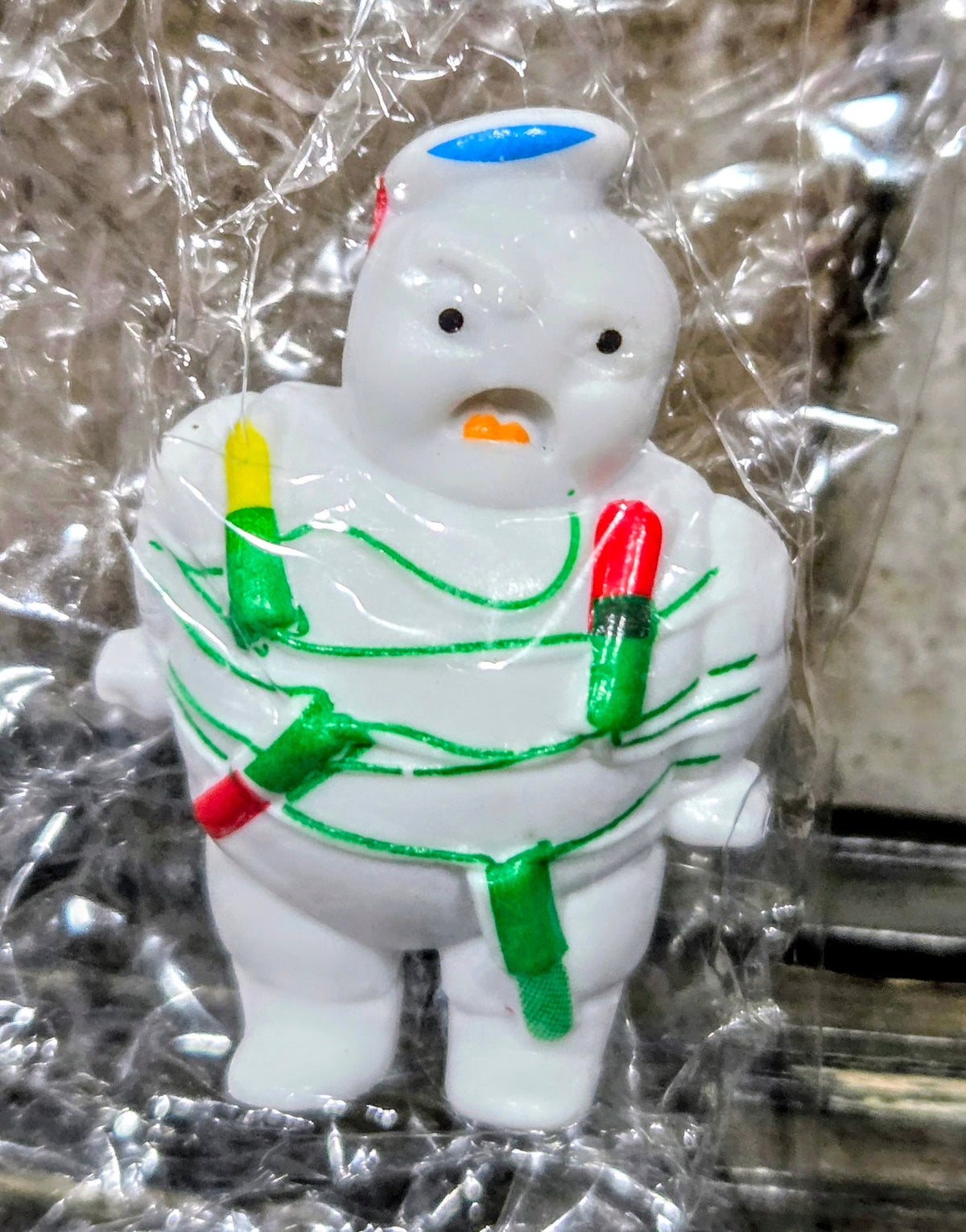 White Mini-Puft ghost figure in green striped suit with red and green accents