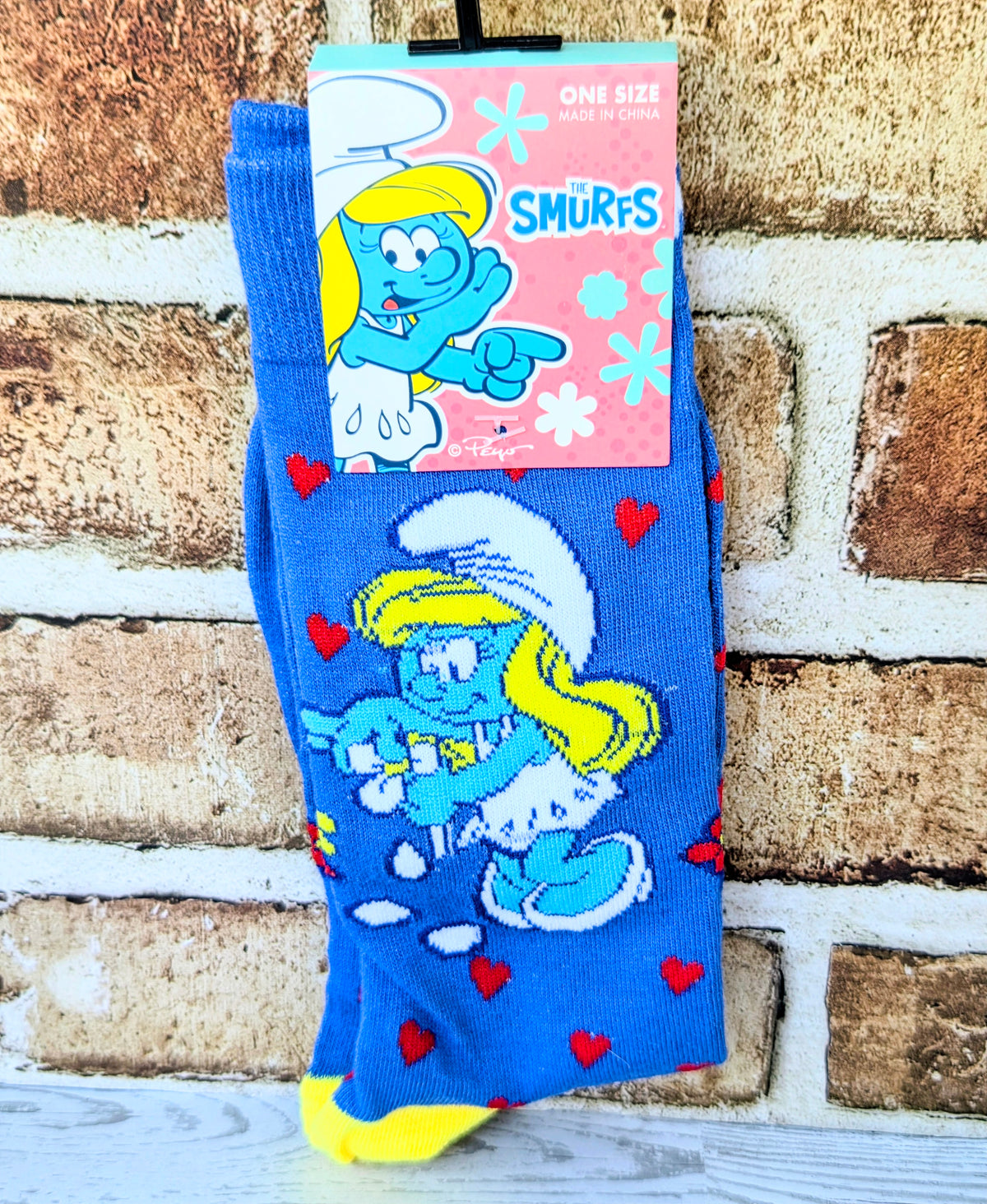 Smurfs character crew socks in blue with multicolor figures and red hearts