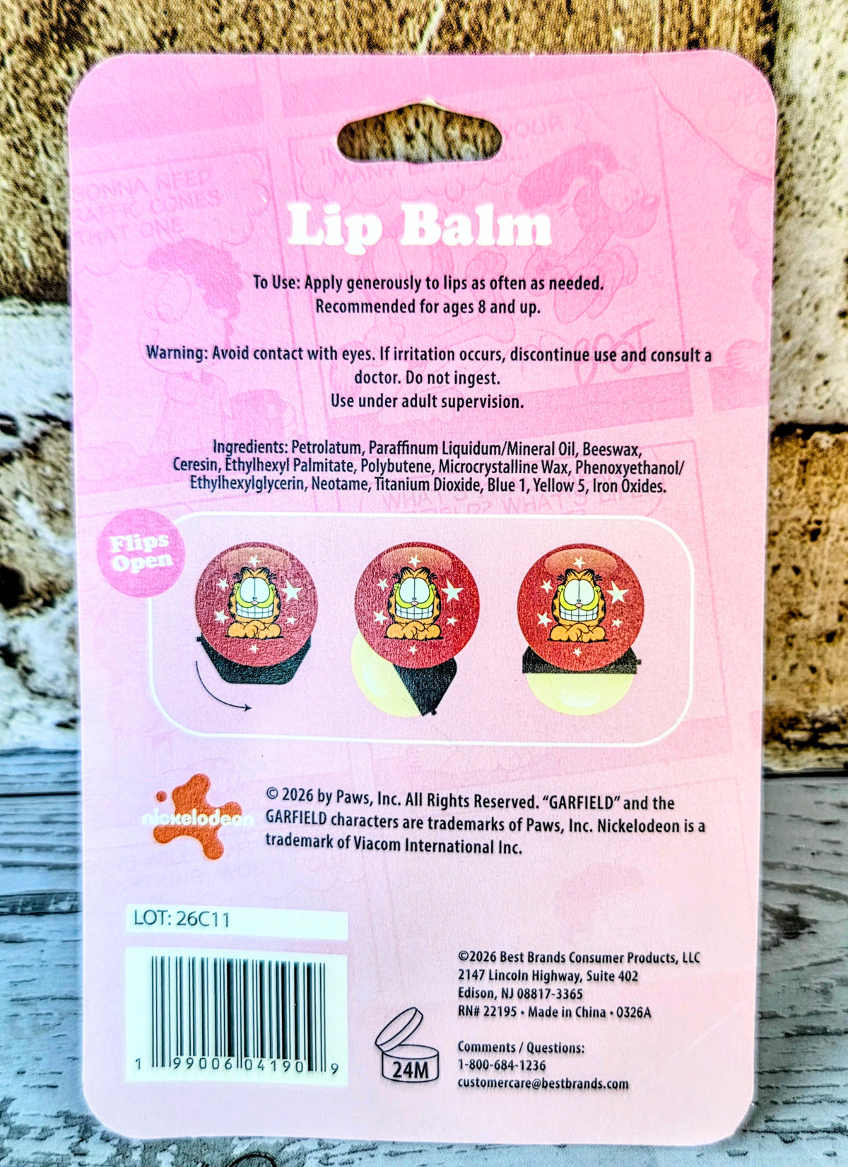 Garfield lip balm back card with flip-open directions and small product icons
