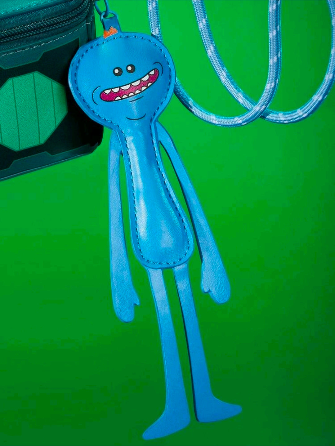 Blue Meeseeks character charm hanging from a teal change bag