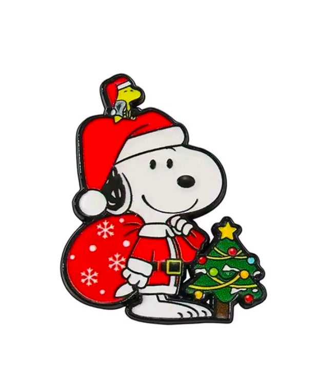 Snoopy Christmas enamel pin with Santa hat, holding tree and red gifts sack