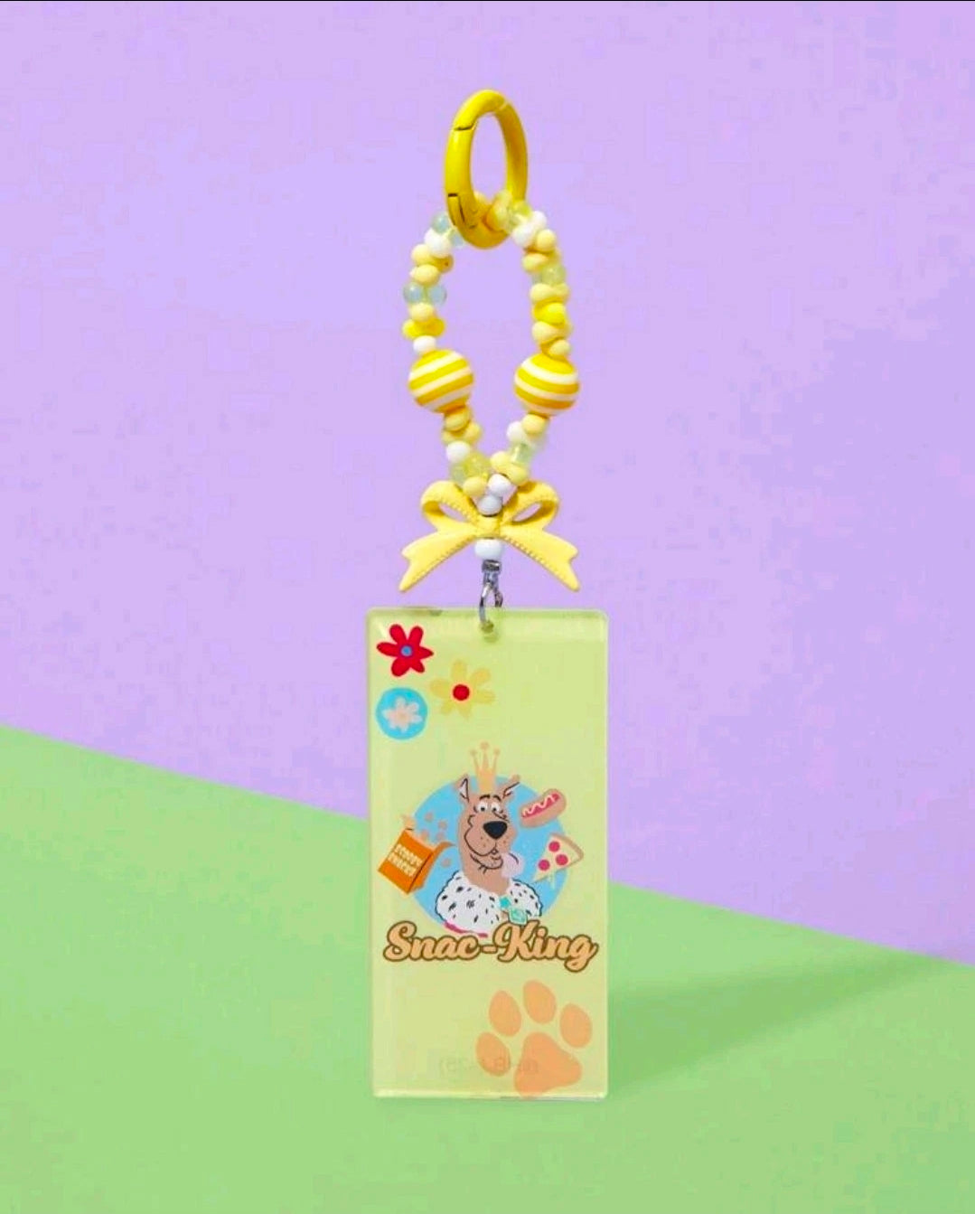 Snack-King keychain with yellow beaded strap and dog charm