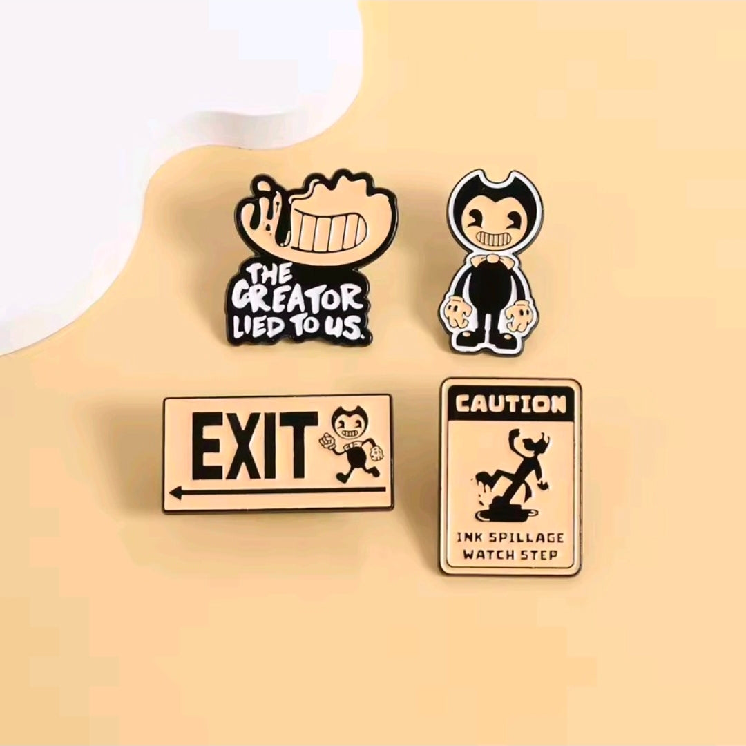 Four enamel pins on light background: EXIT, Caution, The Creator Lied to Us, hooded figure