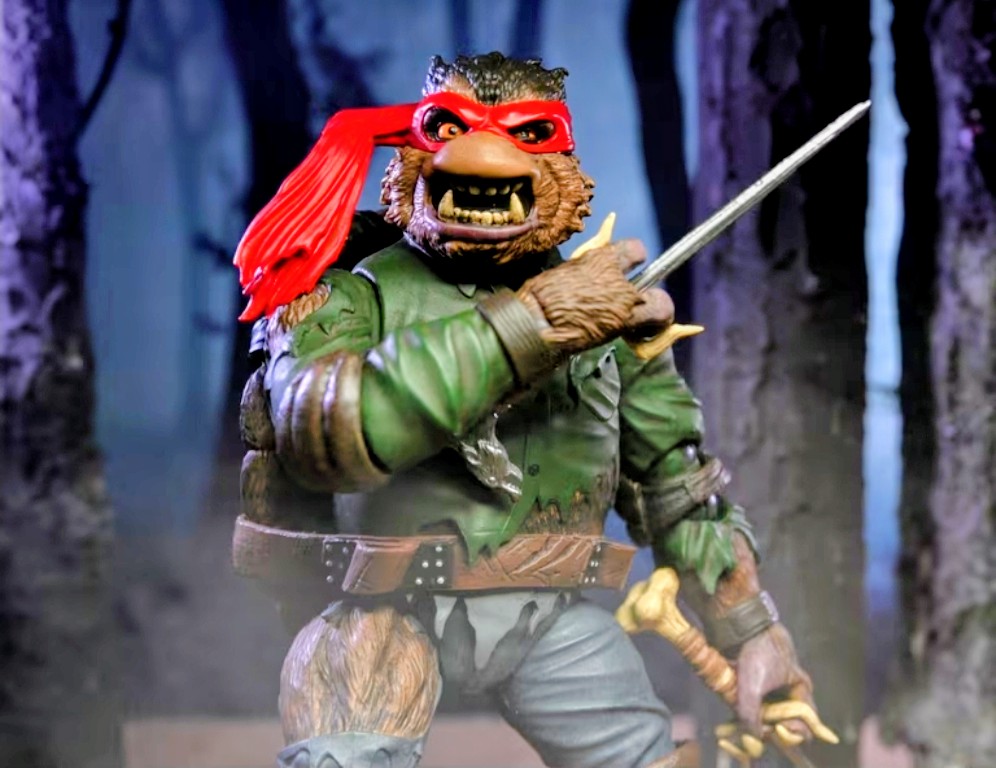 Raphael as Wolf Man figure holding a cane, red mask, green jacket, snarling expression