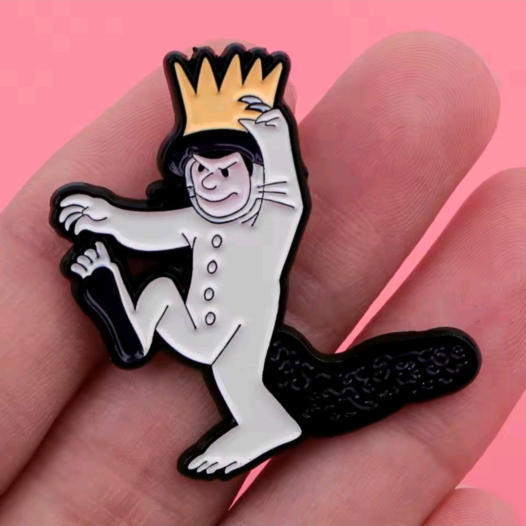 Enamel pin: close-up of white Max character with orange crown and outstretched hand