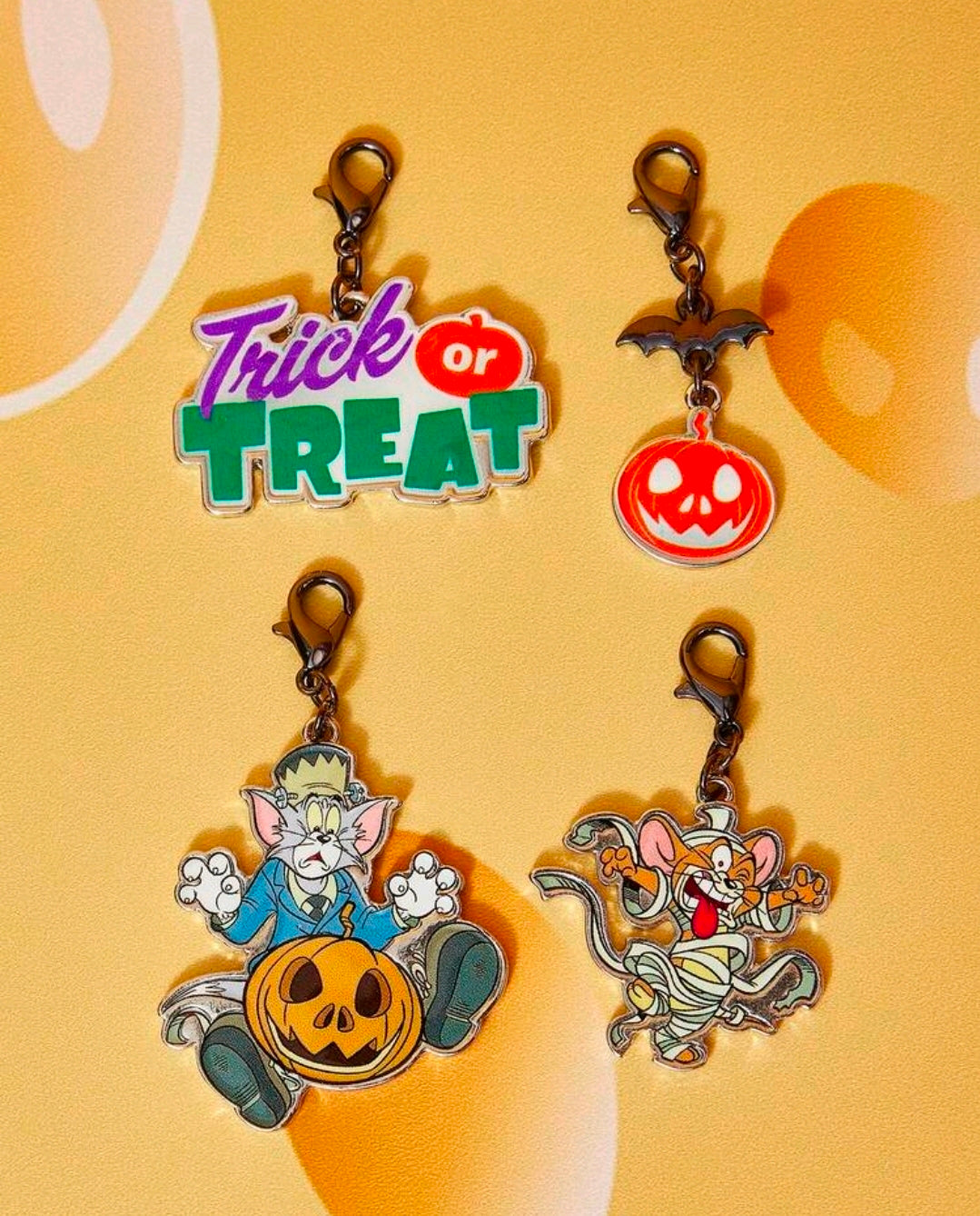 Set of 4 Halloween bag charm clips featuring Trick or Treat, pumpkin, and cartoon character charms