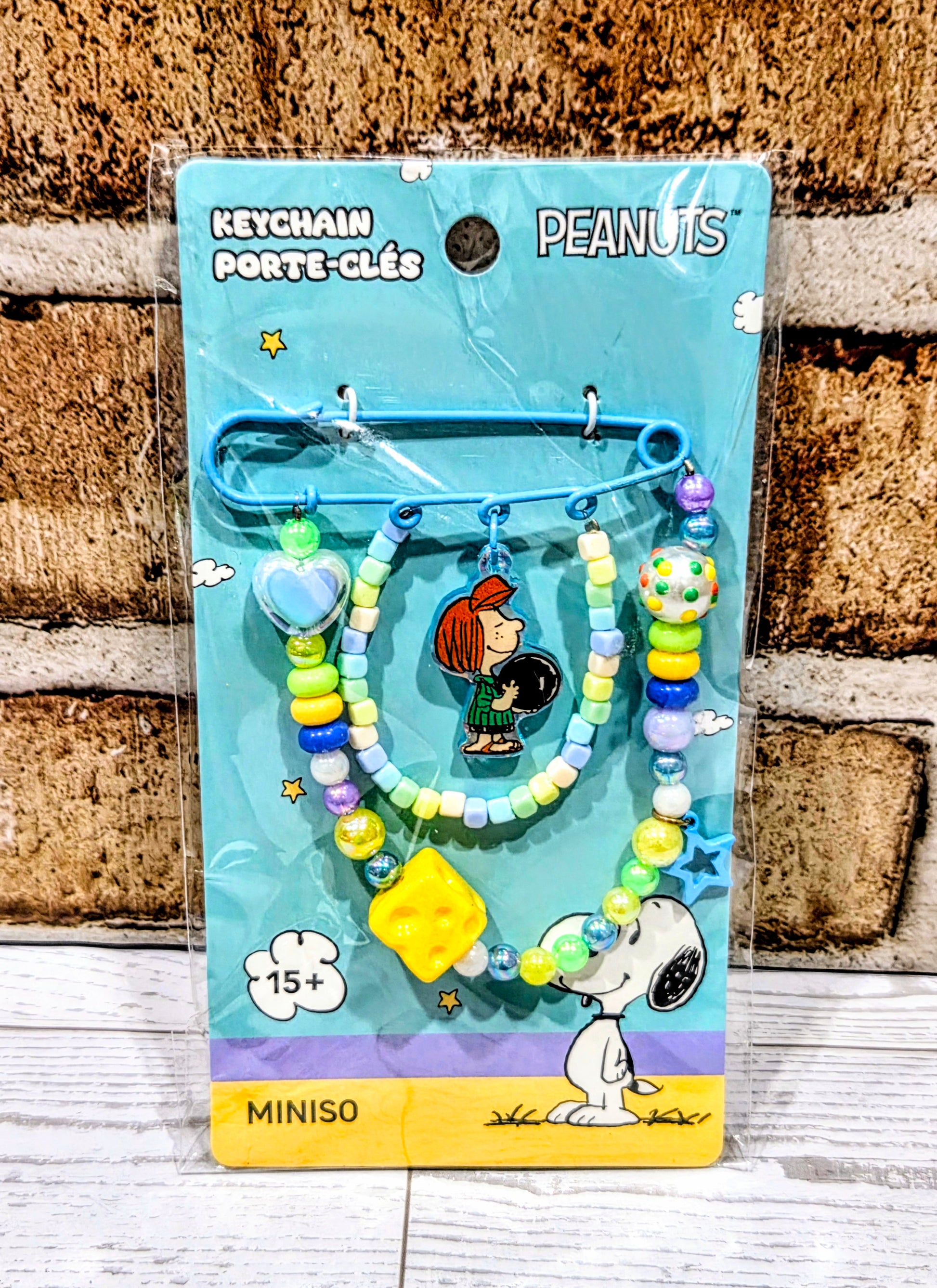 Sally beaded safety pin keychain on card with multicolor beads and heart and star charms