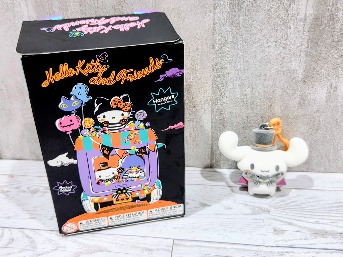 Cinnamoroll Halloween bag clip next to collectible box packaging