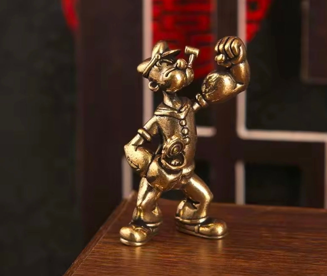 Brass sailor mini statue figure full-body front view, wrench in one hand, fists up