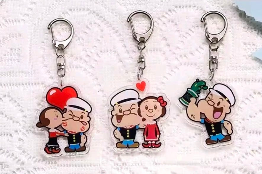 Set of three acrylic keychain charms with Popeye and Olive Oyl cartoon figures
