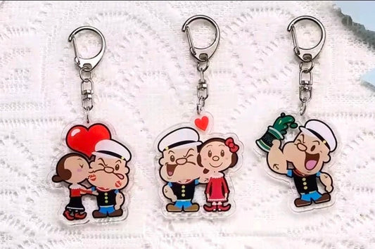 Set of three acrylic keychain charms with Popeye and Olive Oyl cartoon figures