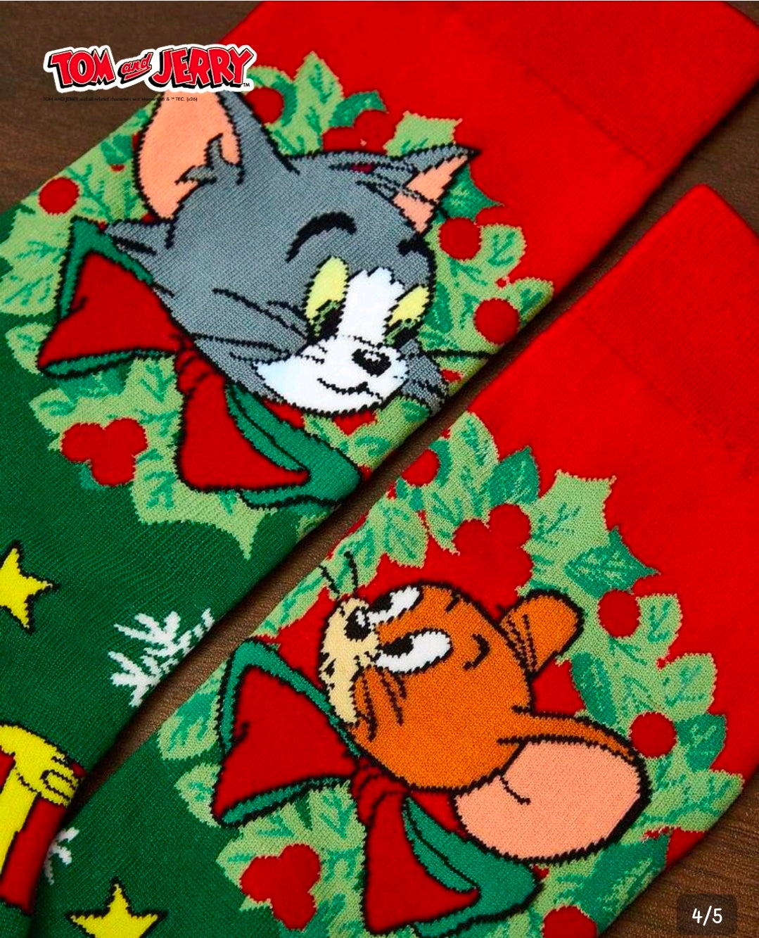 Tom & Jerry holiday crew sock close-up, green with red cuff and character scene