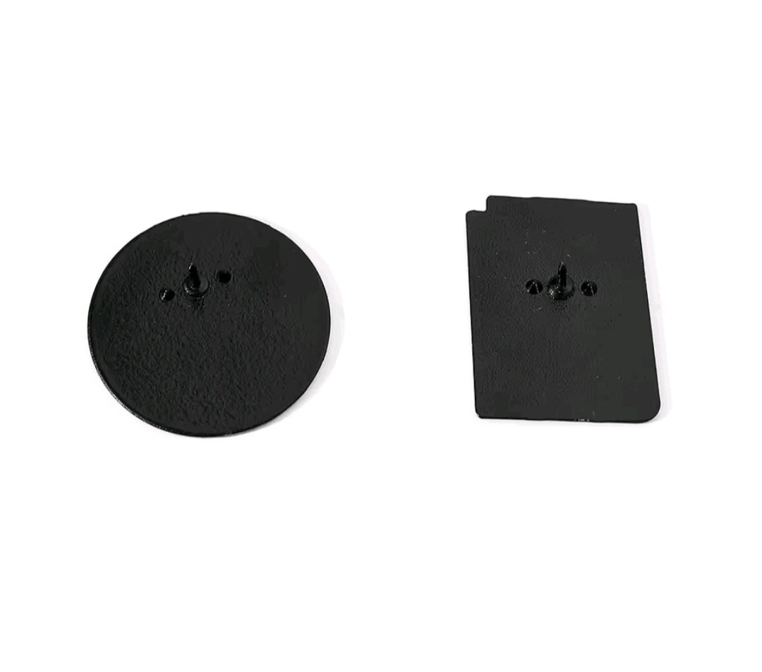 Simpsons enamel pins with black back plates and metal pin posts